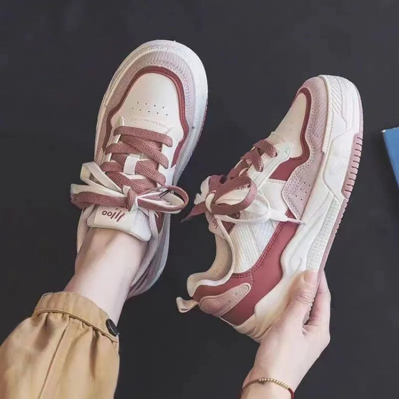 Women's pink and white low-top rubber sneakers with height increasing soles