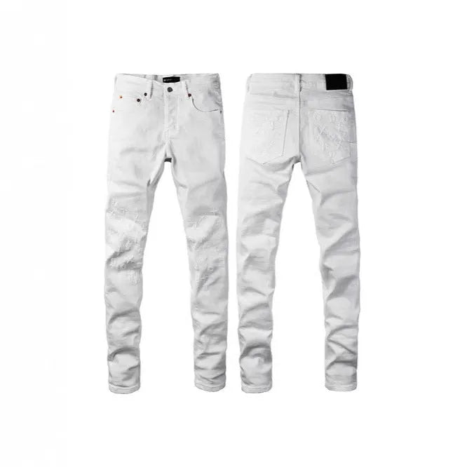 Black slim fit skinny jeans on a man, showing straight leg cut and manual distressing details.