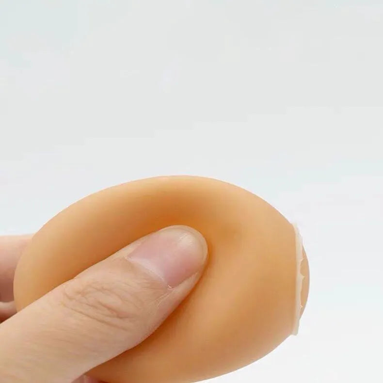 White plastic egg-shaped dog toy with textured surface for tooth cleaning and sound features