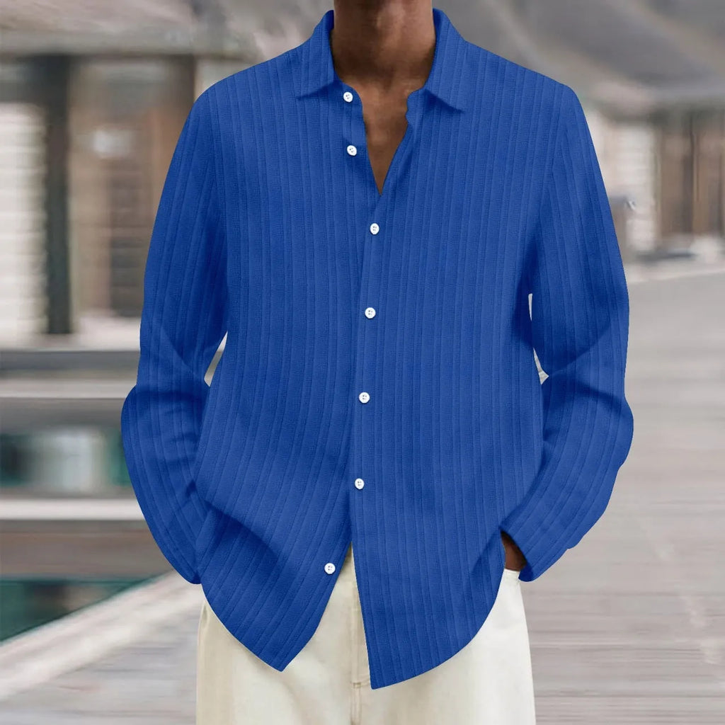 Man wearing a striped British style loose fit long sleeve cardigan shirt.