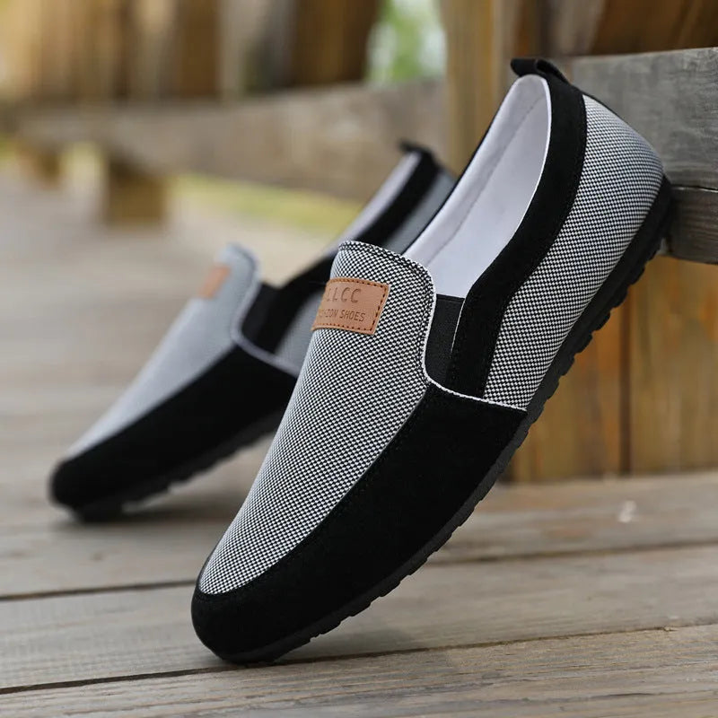 Men's grey canvas casual board shoes with round toe and rubber sole.
