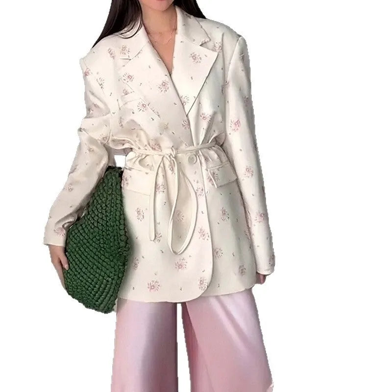 Women's floral print suit jacket with lace-up waist detail on collar, shown in apricot colour