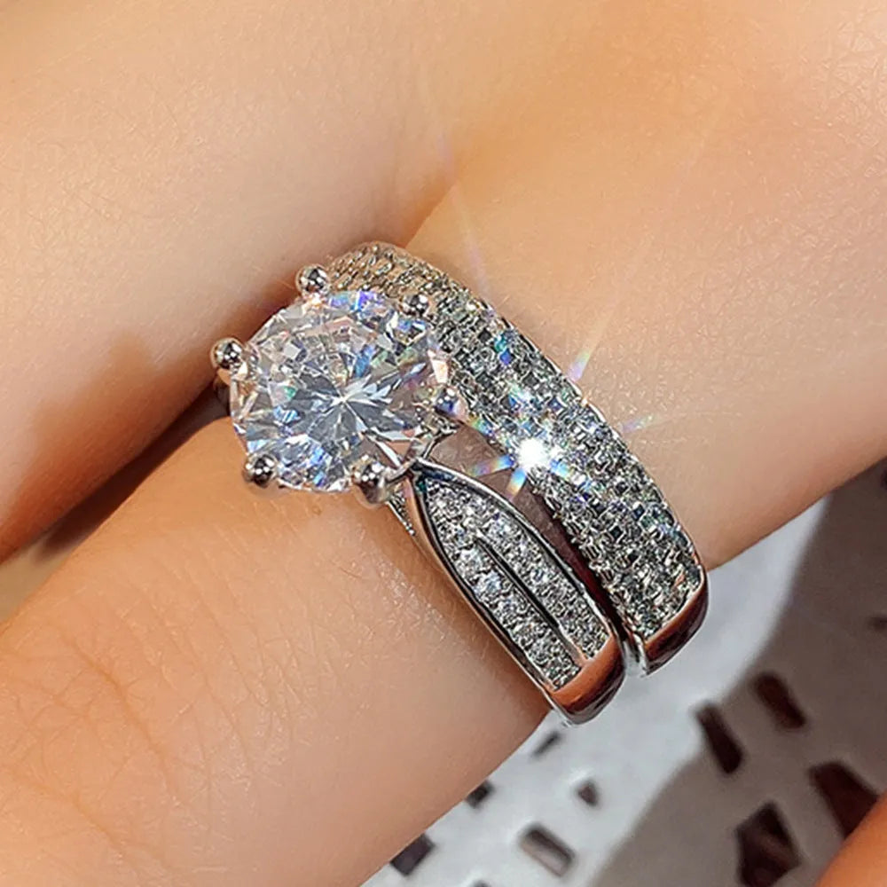 White gold colour alloy wedding ring bracelet with geometric round design showing seven available ring sizes