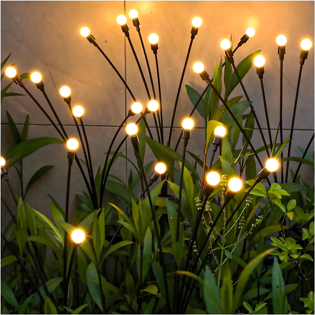 Solar-powered garden ground light with multiple LED heads and automatic dusk-to-dawn operation