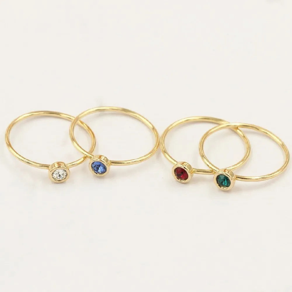 Women's 14K gilded copper knuckle ring with green cubic zirconia stone in US size 7.