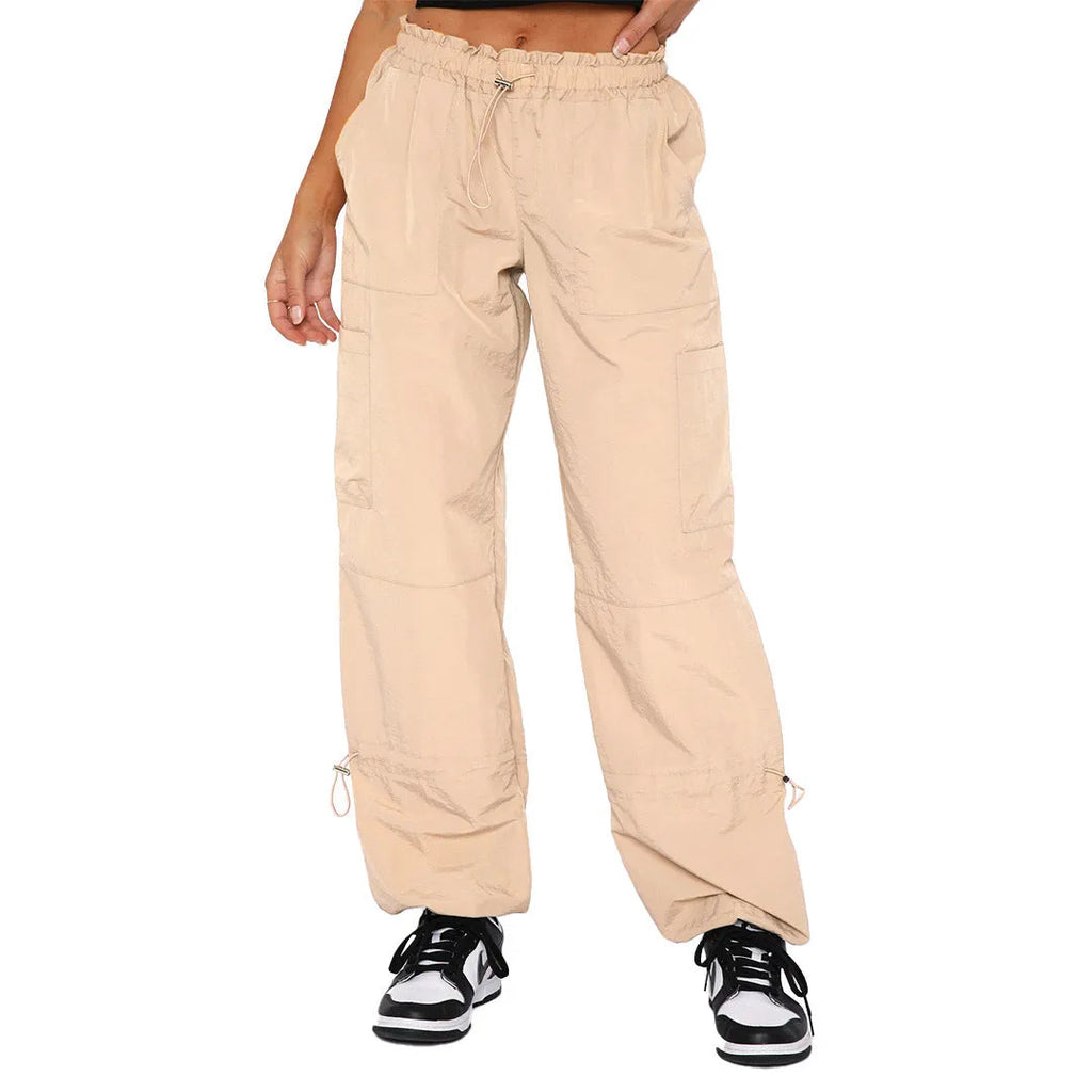 Men's loose-fit multi-pocket cargo casual trousers in polyester fabric on a hanger.