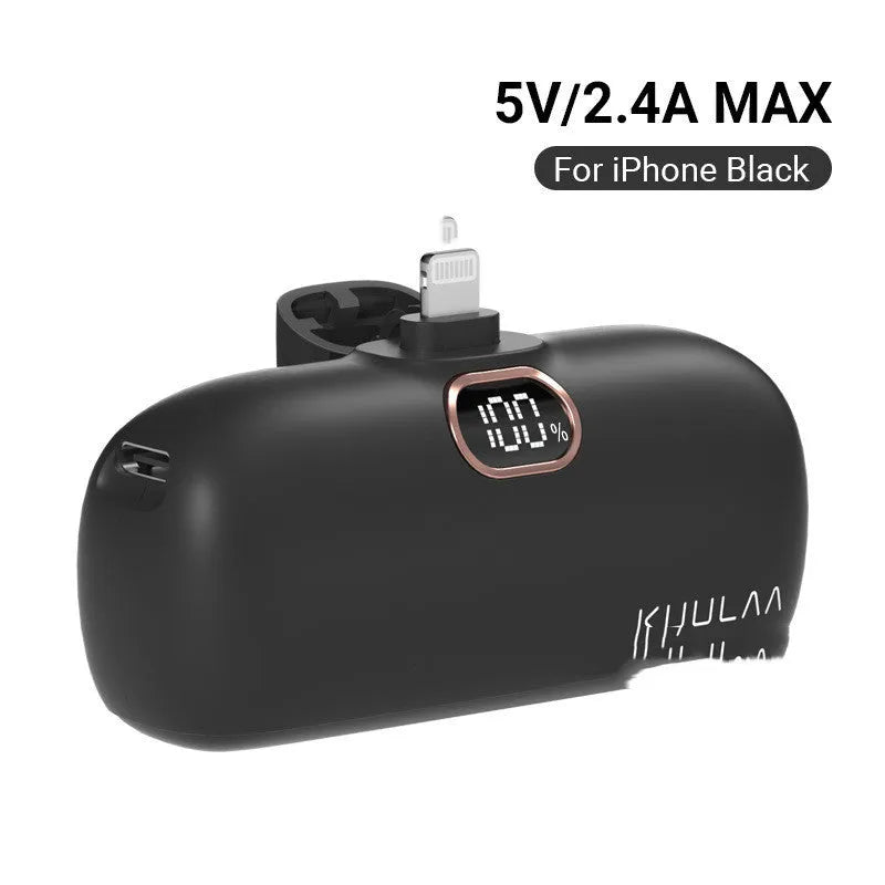 Cylindrical capsule power bank with built-in charging cable in black, white, or purple.