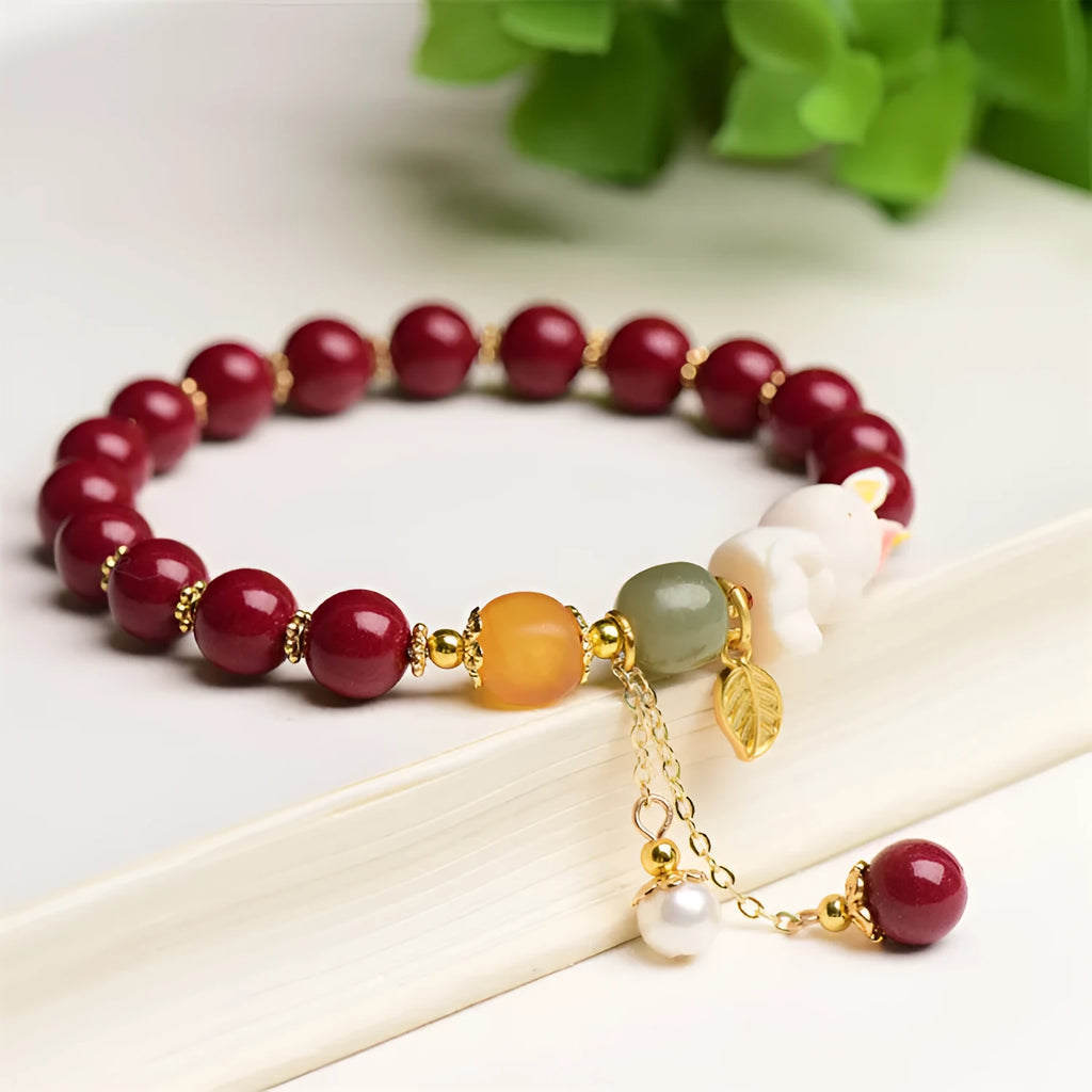 Natural cinnabar bracelet for women in purple-gold sand with rabbit motif, showing 8mm and 10mm bead size options.