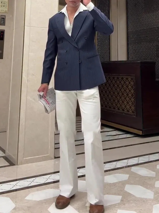 Men's striped double breasted blazer jacket on a hanger showing regular fit design