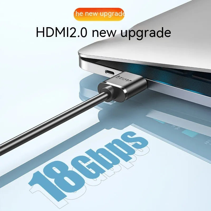 Thin flexible HDMI cable with gold-plated connectors on a white background.