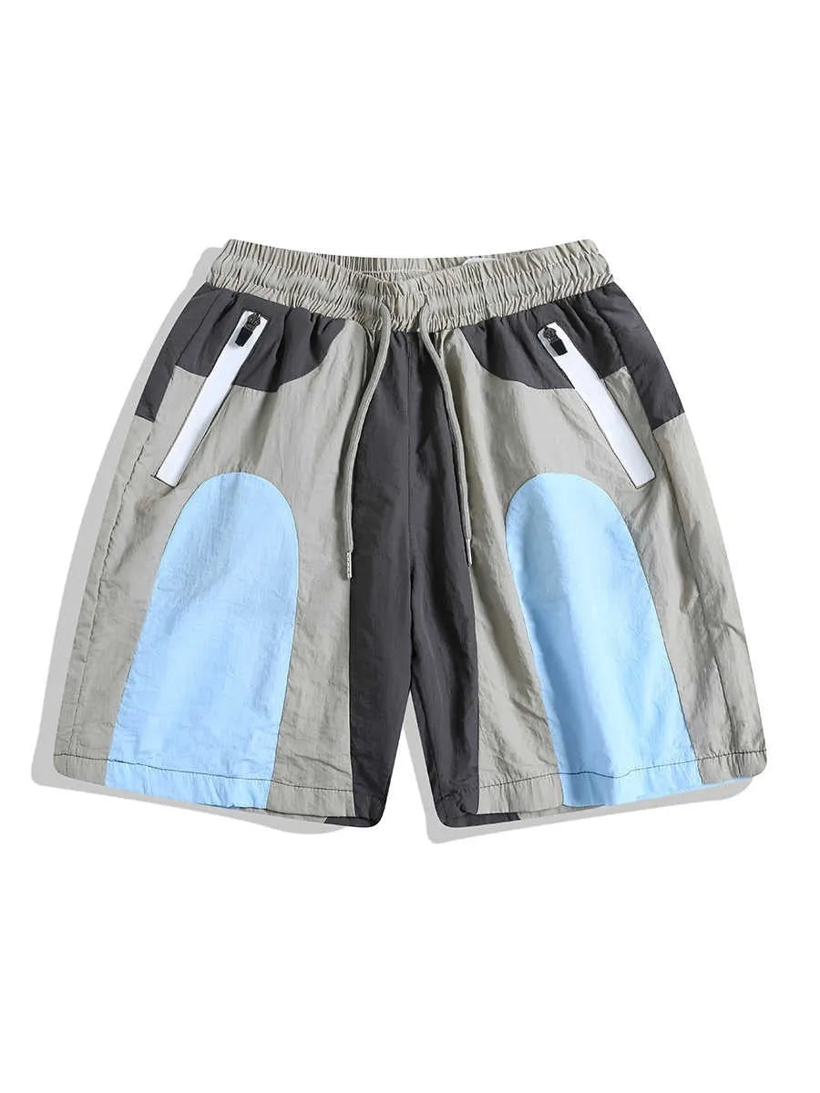 Blue patchwork quick-drying men's shorts with loose straight-leg fit and elasticated waist.