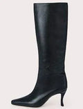 Women's black square toe cowboy ankle boots made from microfiber, shown from the side.