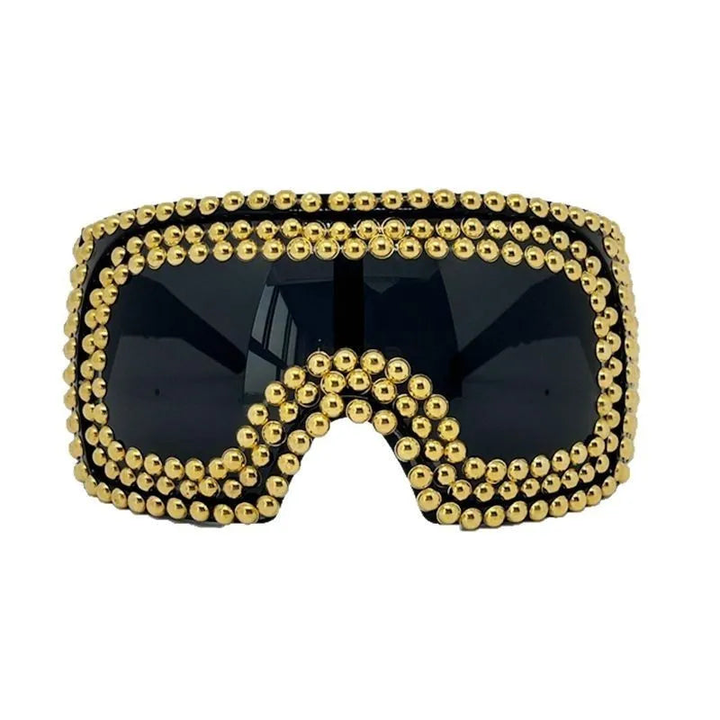 Men's punk style square sunglasses with large frames and silver rivet details
