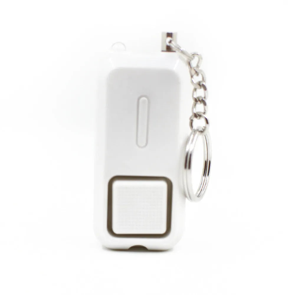 ZQ-202 personal safety alarm in pink, showing compact size next to a ruler for scale.
