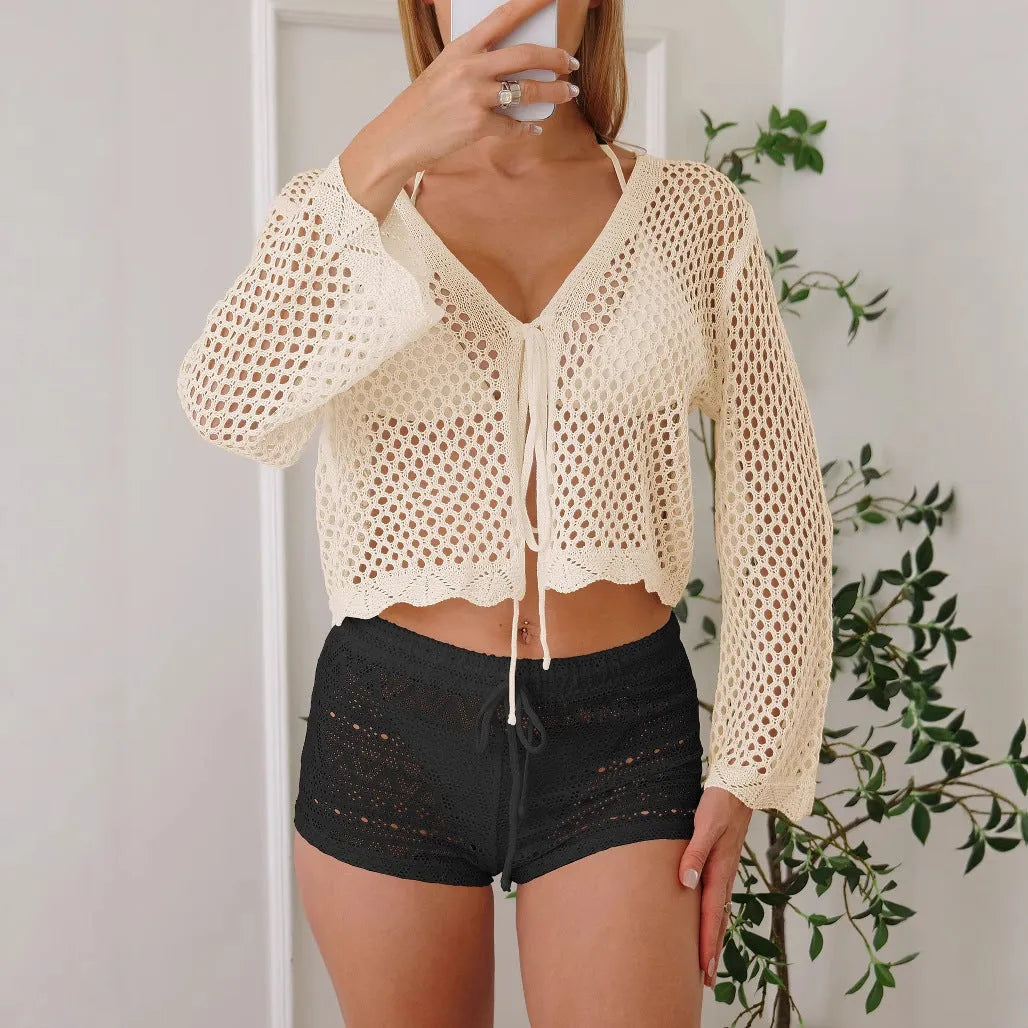 Women's hollow woven cardigan blouse with bell sleeves in apricot colour showing texture detail