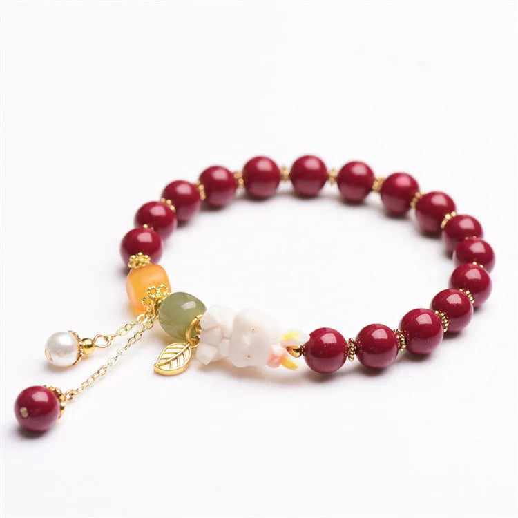 Natural cinnabar bracelet for women in purple-gold sand with rabbit motif, showing 8mm and 10mm bead size options.