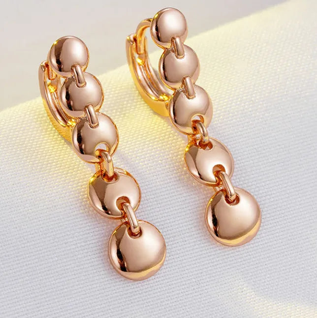 Retro gold tone woven copper circle drop earrings with vintage styling