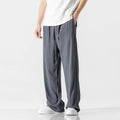 Men's beige bamboo fibre linen trousers with a straight leg, cropped length, and drawstring waist on a mid-rise.