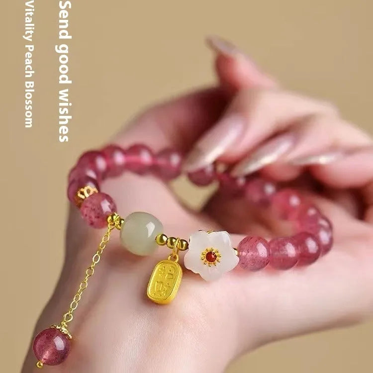 Handcrafted strawberry quartz crystal bracelet with Hetian jade peach blossom design for women
