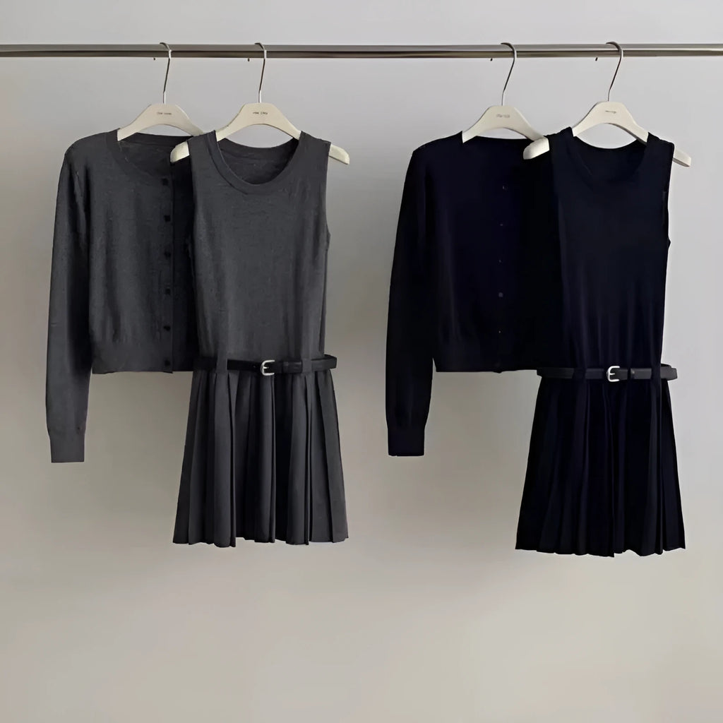 Women's grey knitted national style two-piece set with cardigan, pleated vest skirt, and belt.