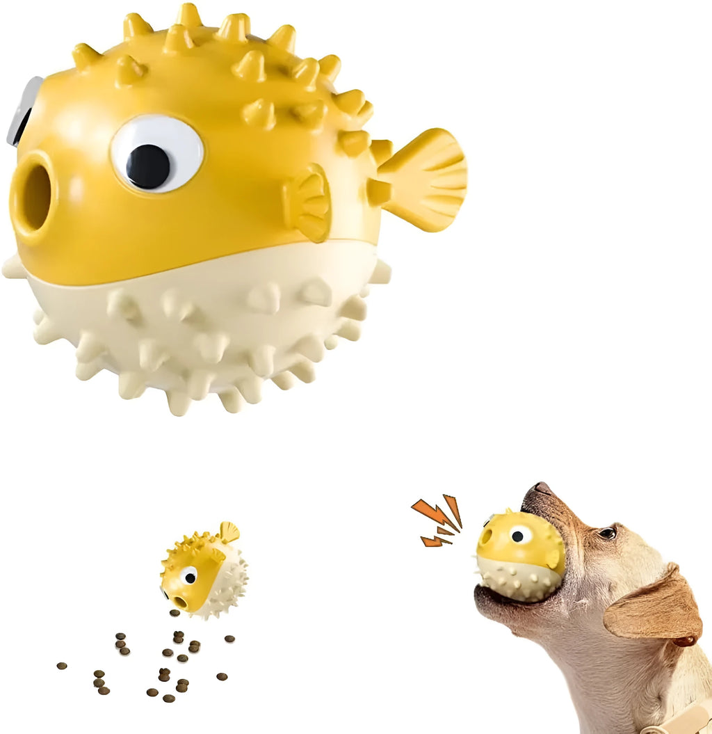 Green fish-shaped interactive dog toy with treat dispensing slots and raised cleaning texture