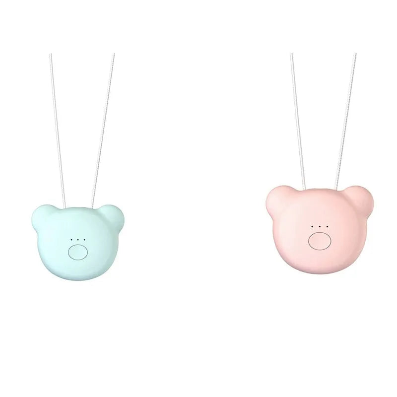 Mini USB portable air purifier necklace in pink, showing compact design with single button.