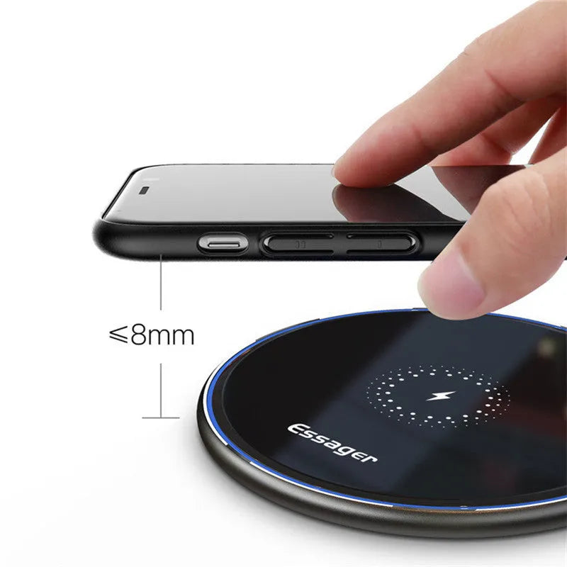 Black or white aluminium alloy wireless charging pad with LED status light, shown with a smartphone on top.
