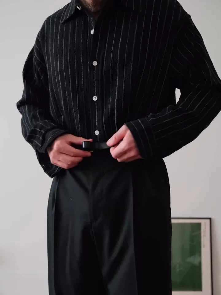 Black pinstriped polyester button-down shirt with collar, shown front view