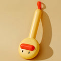Small yellow duck-shaped pet comb with needle bristles for cat and dog grooming