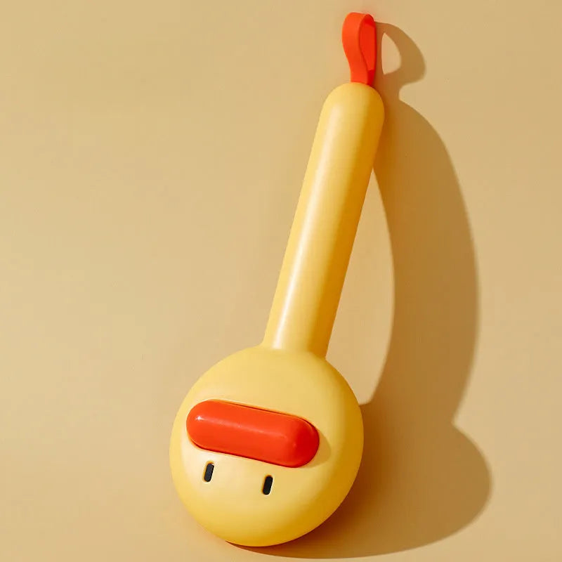 Small yellow duck-shaped pet comb with needle bristles for cat and dog grooming