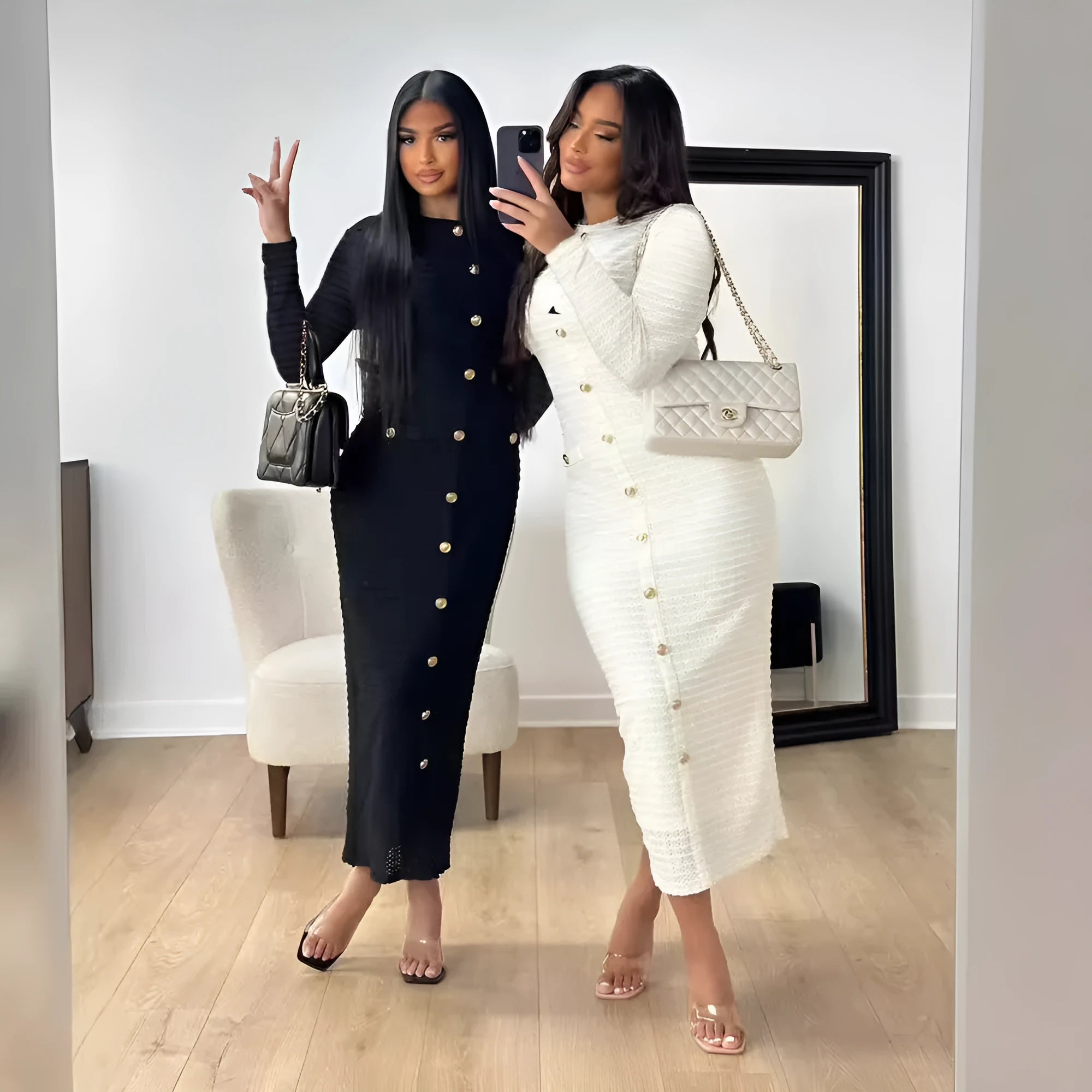 Black and white French retro slim fit knitted long-sleeved dress with button details.