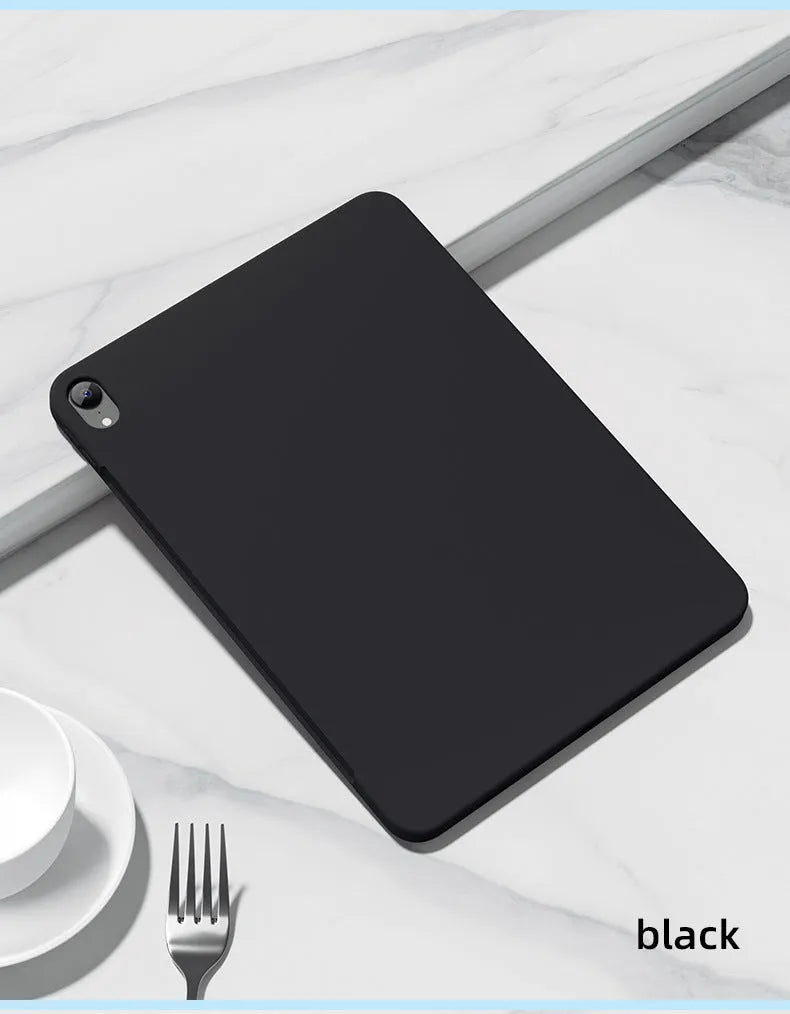 A solid-colour liquid silicone back cover case for an iPad, shown in a selection of seven different colours.