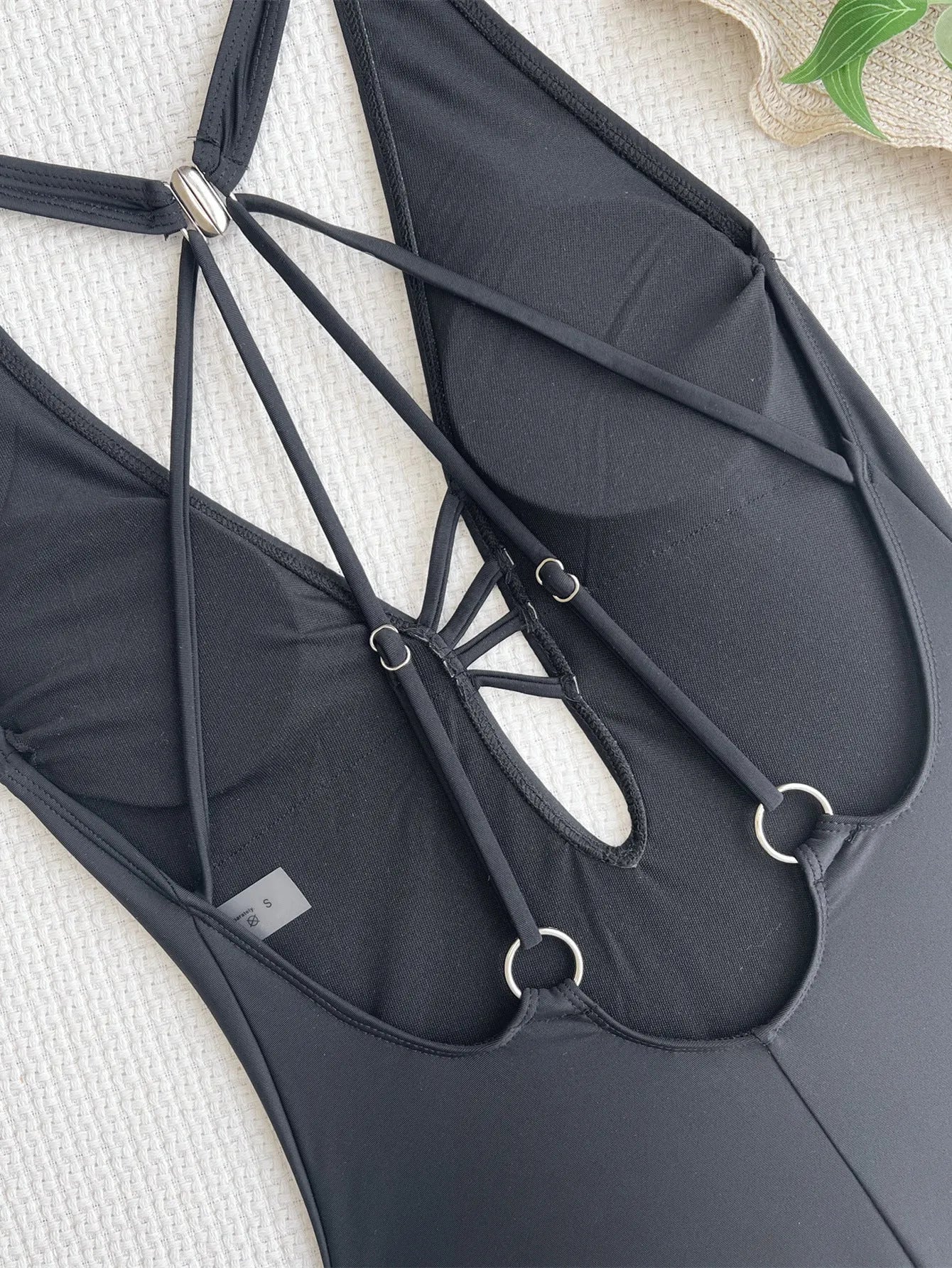 Black one-piece ladies bikini swimsuit made from nylon fabric