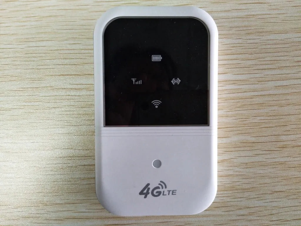 White 4G LTE car router with USB cable, compact 10.8 cm size, on a table surface