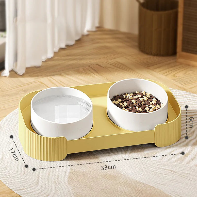 Green ceramic elevated cat bowl set with two dishes on a tilted, non-slip stand