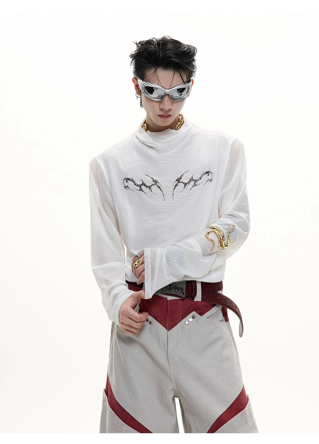 Man wearing a black niche mesh slim-fit long sleeve shirt showing texture and fit.