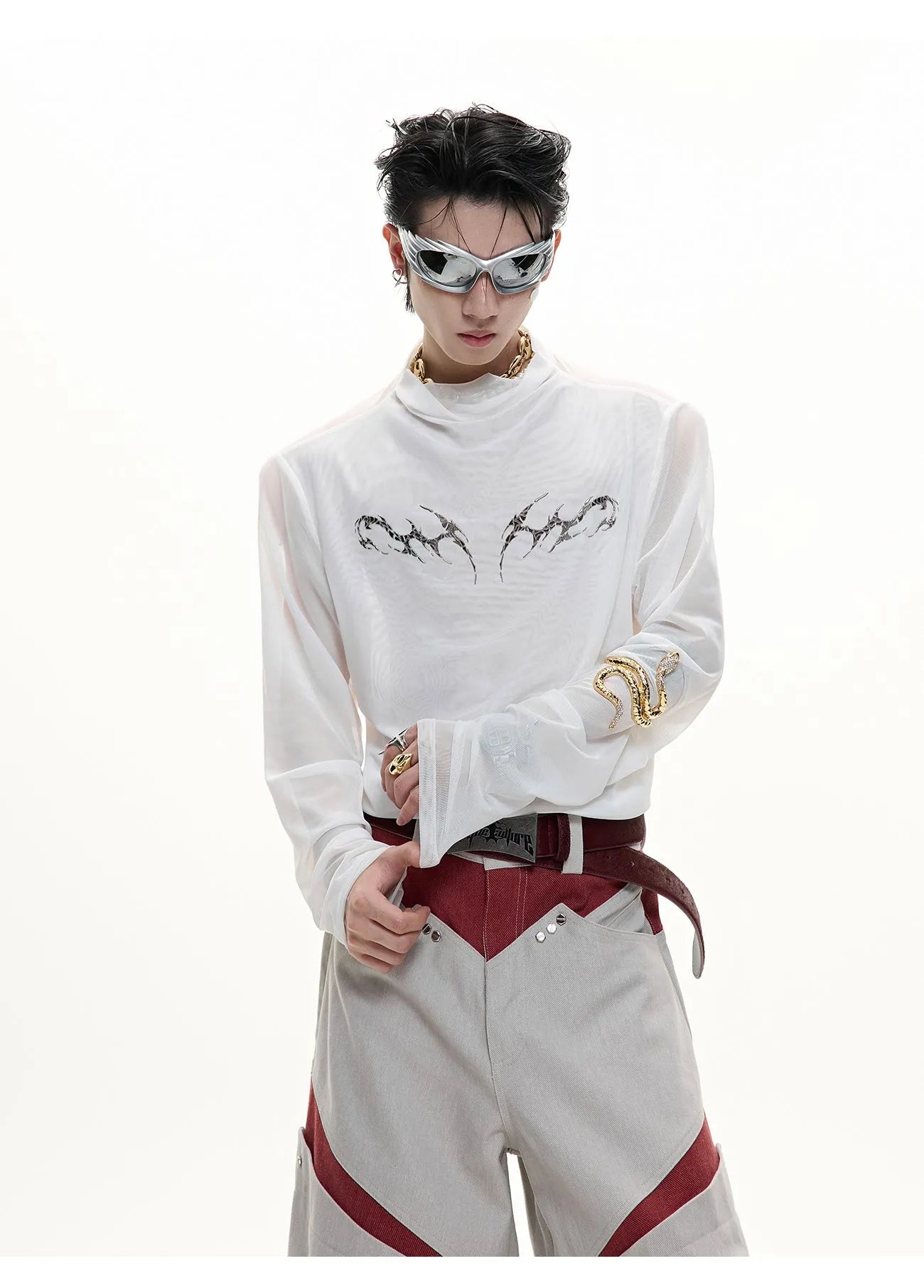 Man wearing a black niche mesh slim-fit long sleeve shirt showing texture and fit.