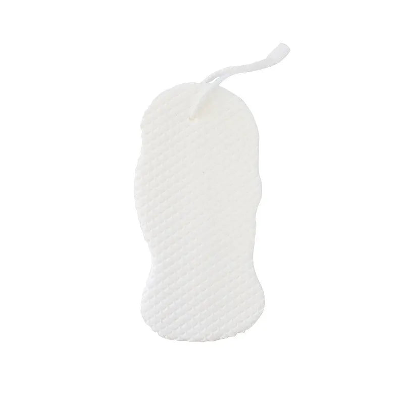 3D fish scale pattern bath sponge ball in assorted colours on a bathroom background.