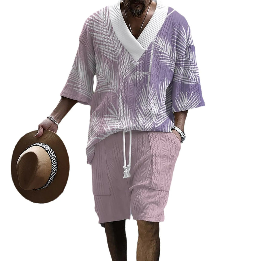 Man wearing a printed drop-shoulder knitted short-sleeve top with matching shorts, a casual loungewear set.