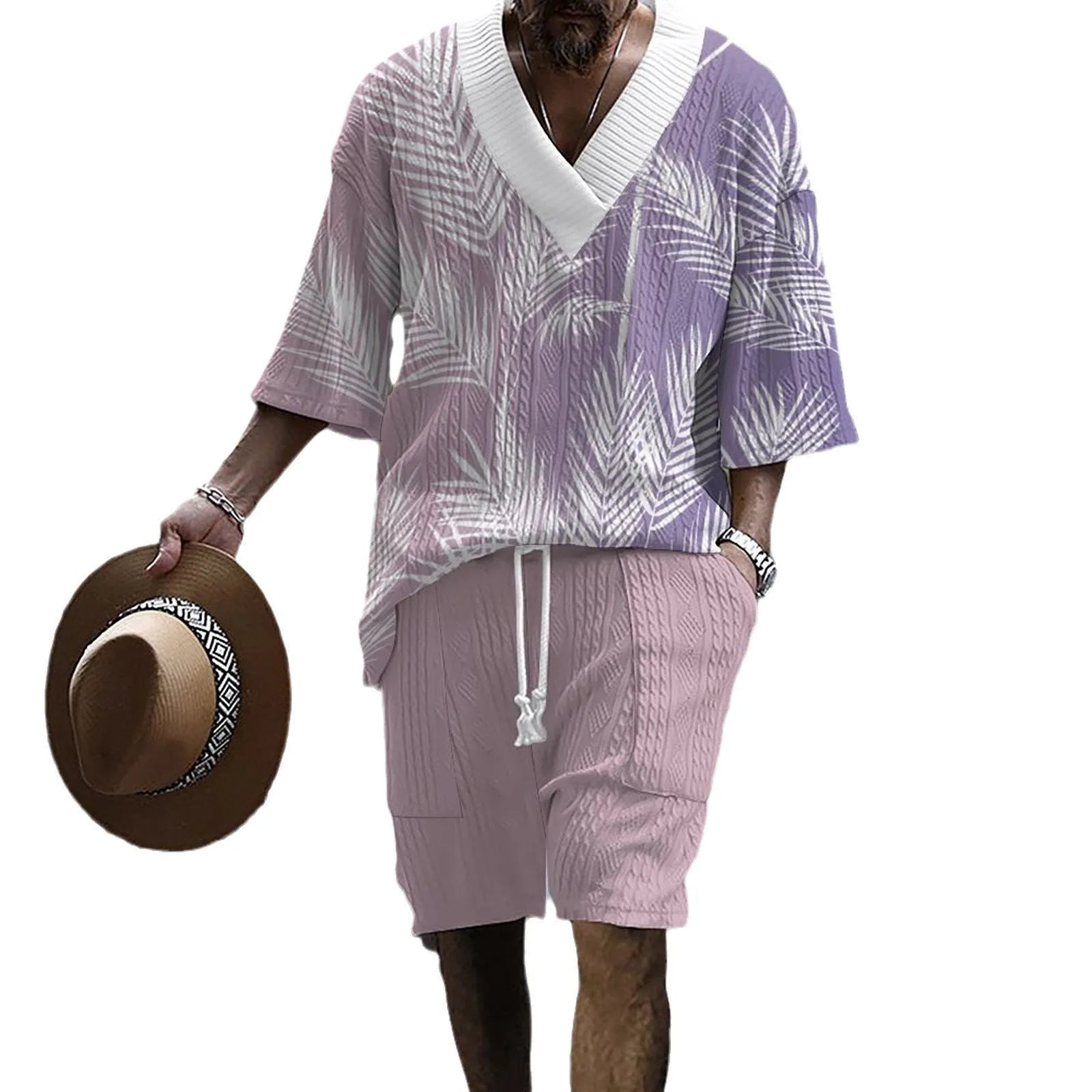 Man wearing a printed drop-shoulder knitted short-sleeve top with matching shorts, a casual loungewear set.
