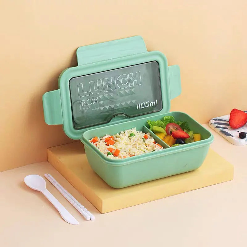 Green four-layer partitioned bento lunch box with Nordic style design, shown open.