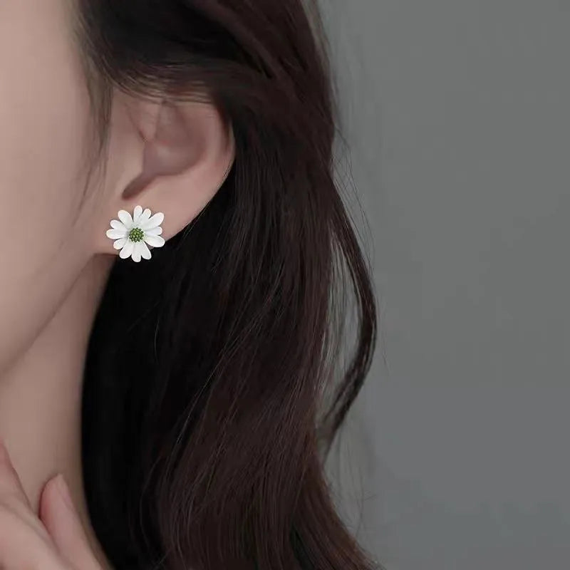 Alloy flower-shaped stud earrings in white and green, yellow and white, and blue orange colour combinations with butterfly clutch fastenings