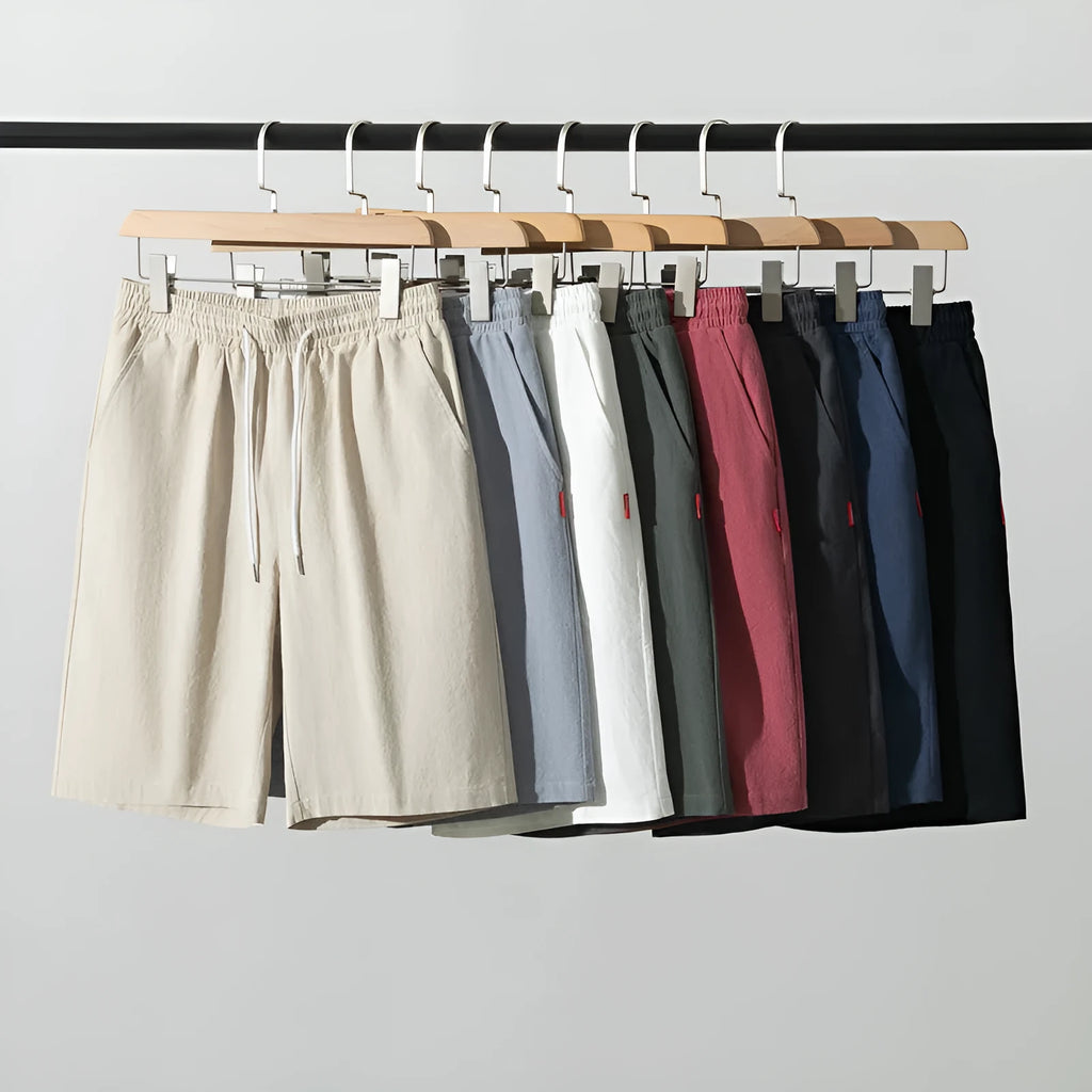 Solid colour cotton linen cropped summer pants on a hanger, showing mid-waist and drawstring detail.