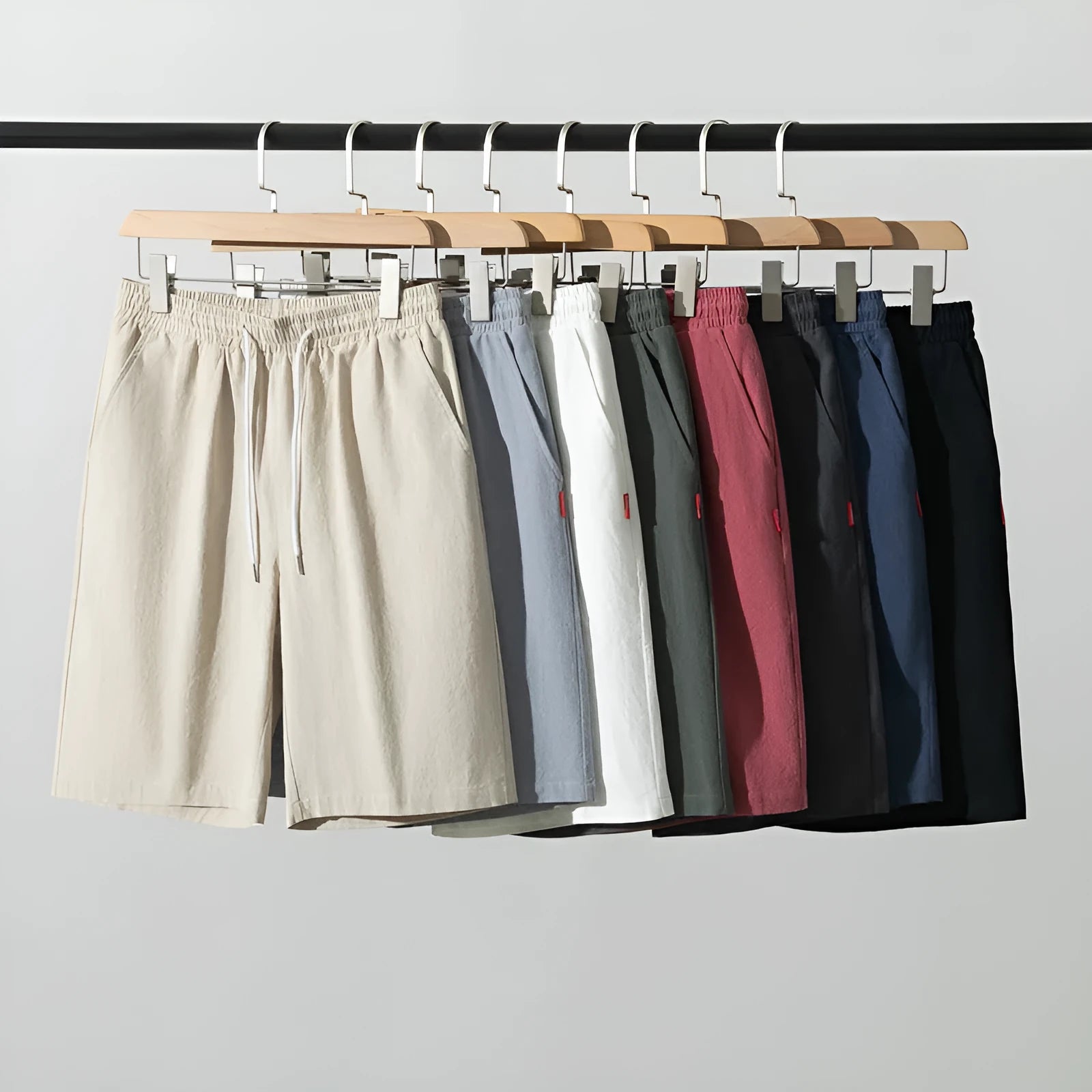 Solid colour cotton linen cropped summer pants on a hanger, showing mid-waist and drawstring detail.