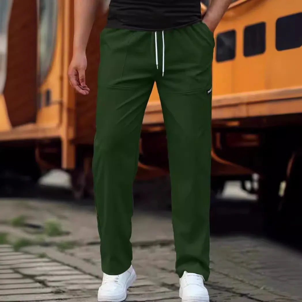 Men's slim fit polyester casual trousers in light gray colour on a hanger.