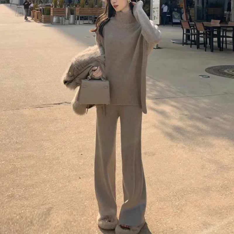 Women's casual two-piece set with an acrylic sweater and wide-leg trousers in a solid colour.