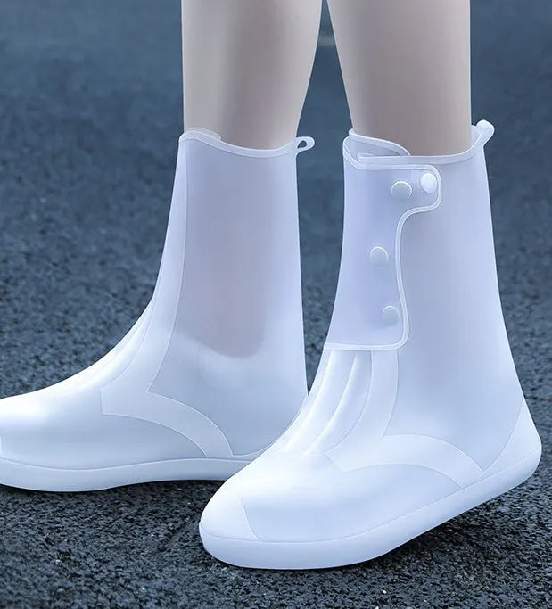 White PVC high top reusable women's water resistant shoe covers showing anti-skid sole and high cylinder design