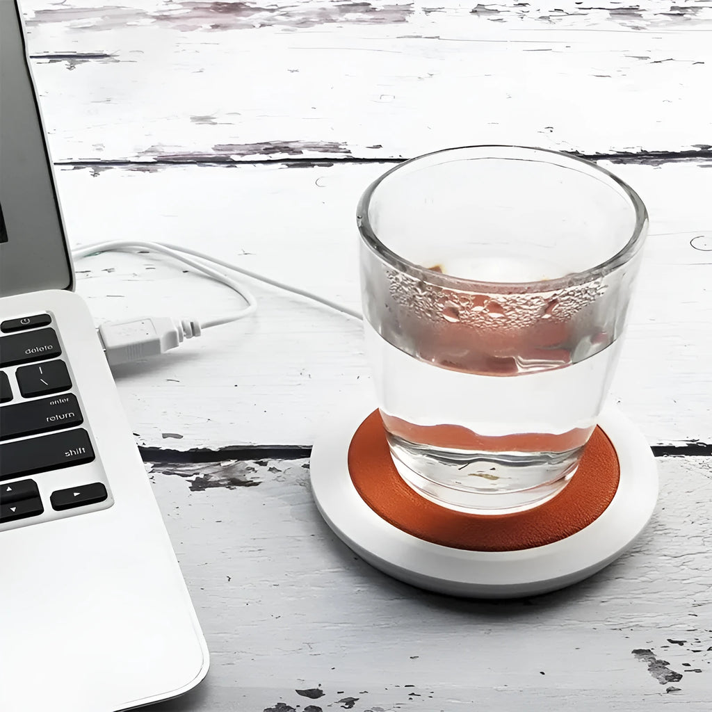 USB-powered insulated heating coaster for mugs in black, blue, and orange colour options.