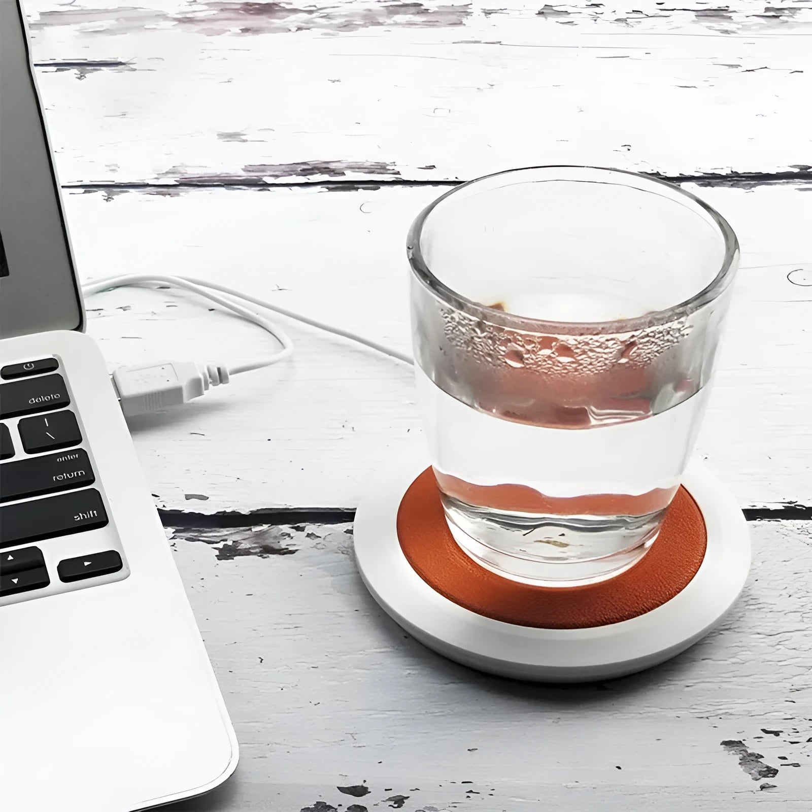 USB-powered insulated heating coaster for mugs in black, blue, and orange colour options.