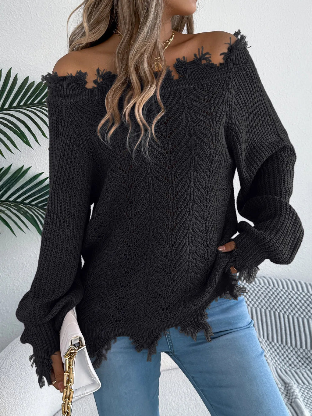 Hollow-out long-sleeved pullover sweater with off-the-shoulder neckline in black colour